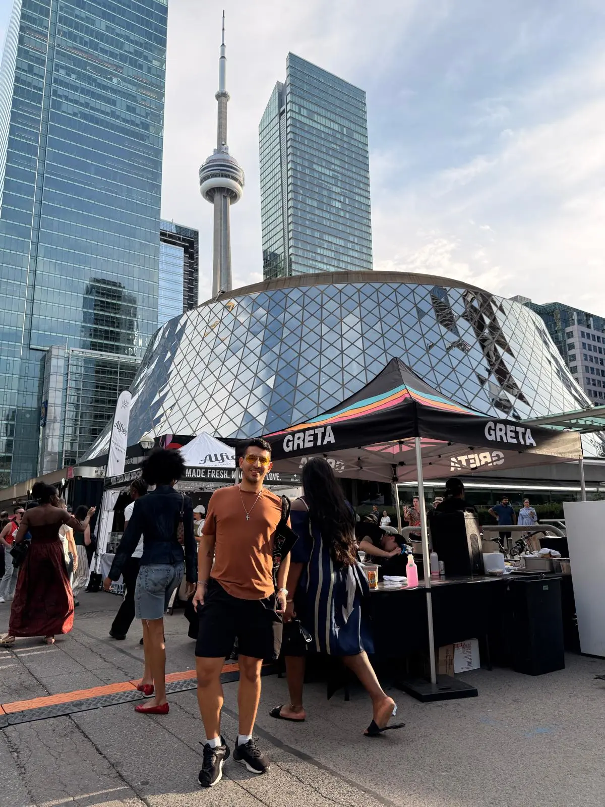 Daniel next to the CN Tower in Toronto